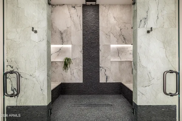 a dining room with furniture a rug and a chandelier
