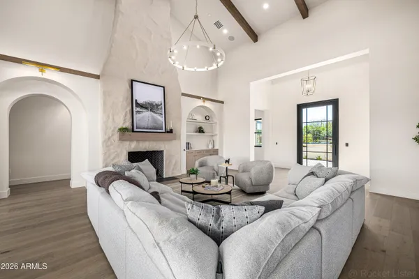 a living room with furniture and a large window