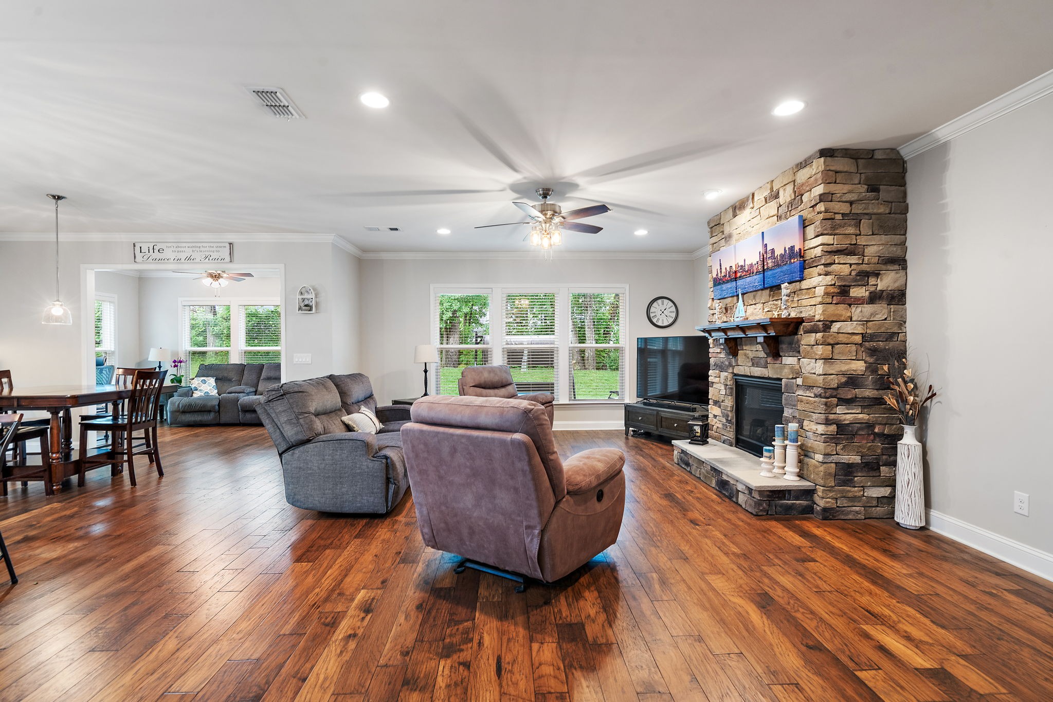 4012 Compass Pointe Court Thompson's Station, TN 37179 - Photo 17 of 54 a living room with fireplace furniture and a wooden floor