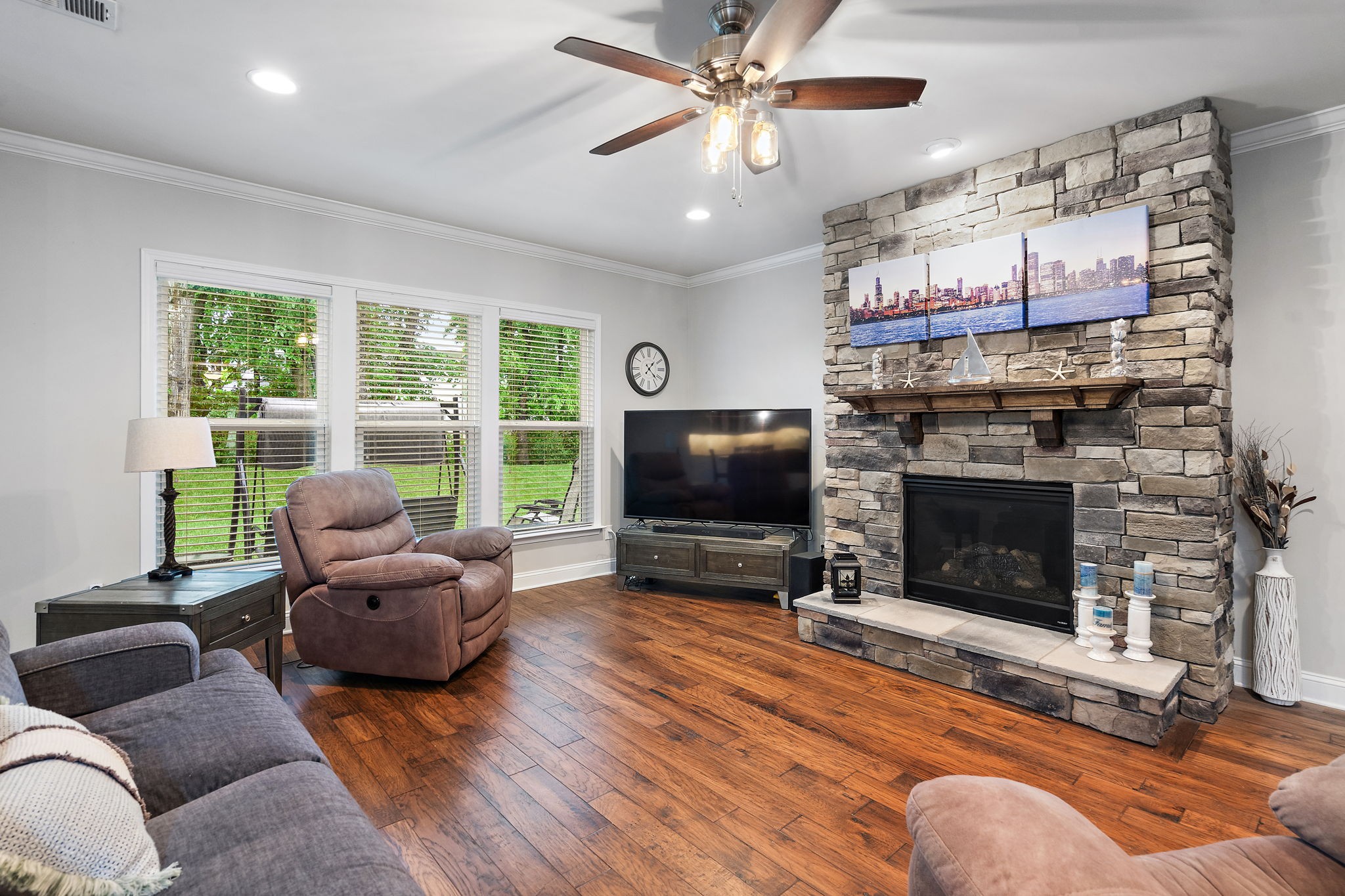 4012 Compass Pointe Court Thompson's Station, TN 37179 - Photo 20 of 54 a living room with furniture a flat screen tv and a fireplace