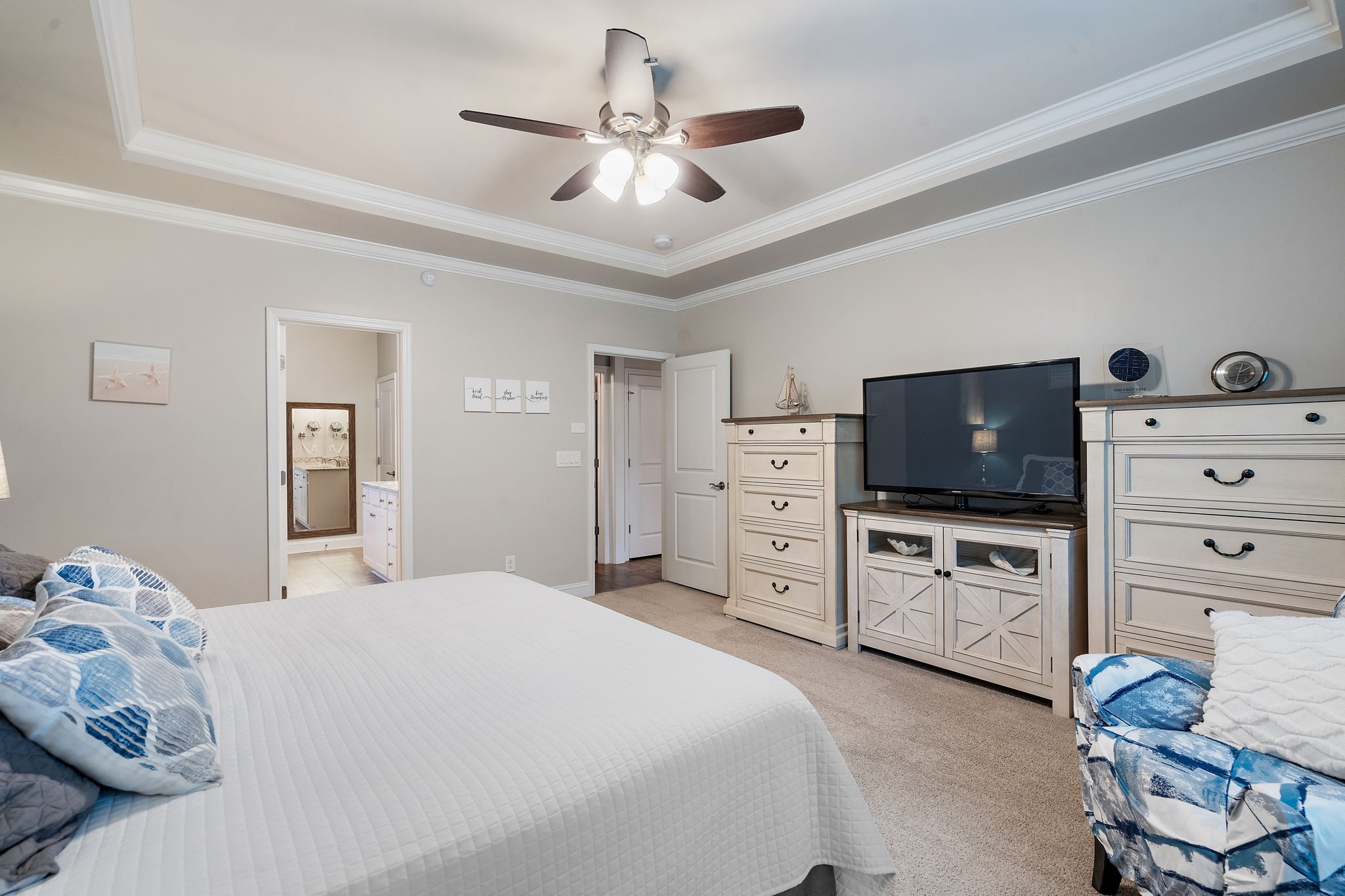4012 Compass Pointe Court Thompson's Station, TN 37179 - Photo 24 of 54 a bedroom with a bed and flat tv screen on dresser