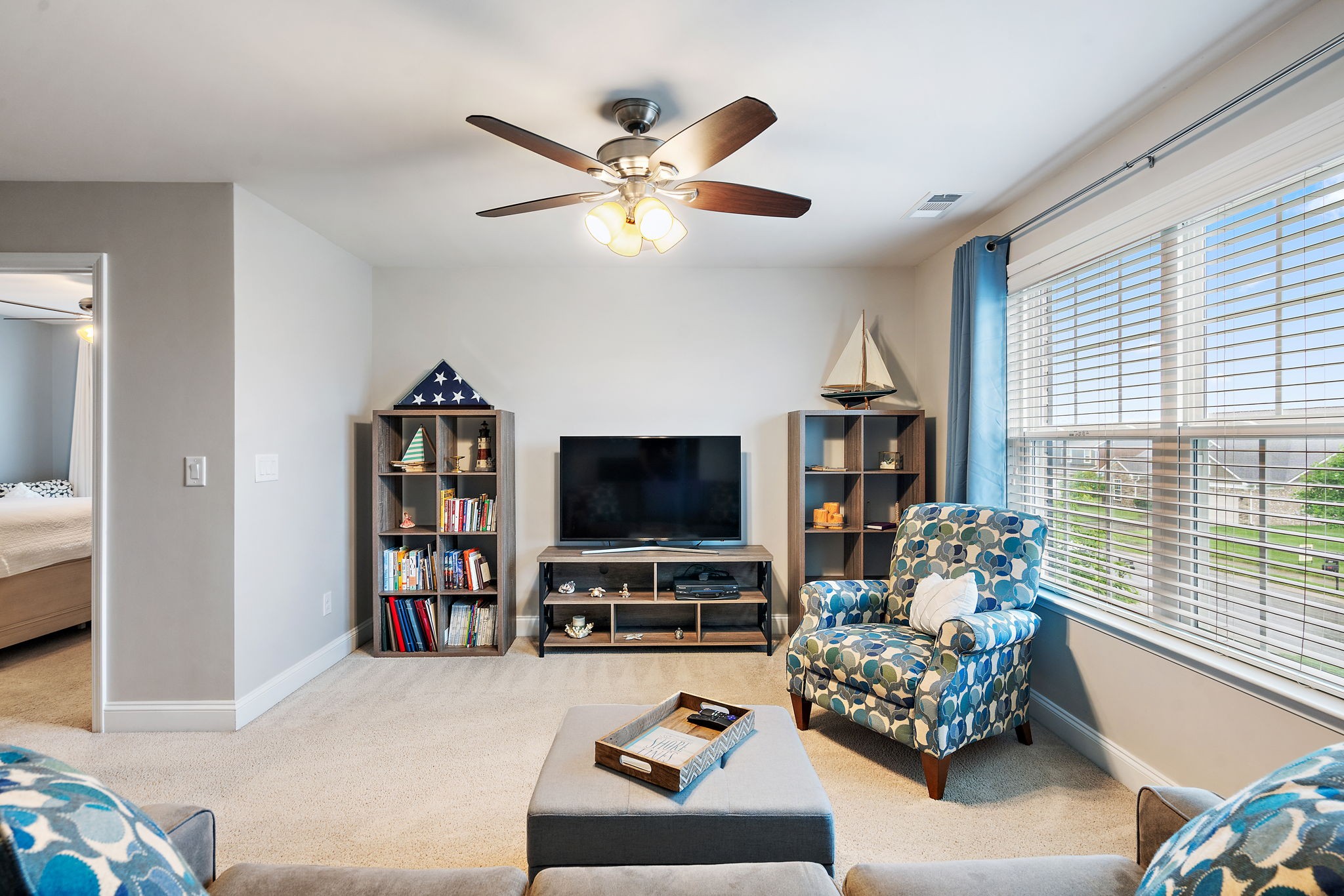4012 Compass Pointe Court Thompson's Station, TN 37179 - Photo 31 of 54 a living room with furniture and a flat screen tv