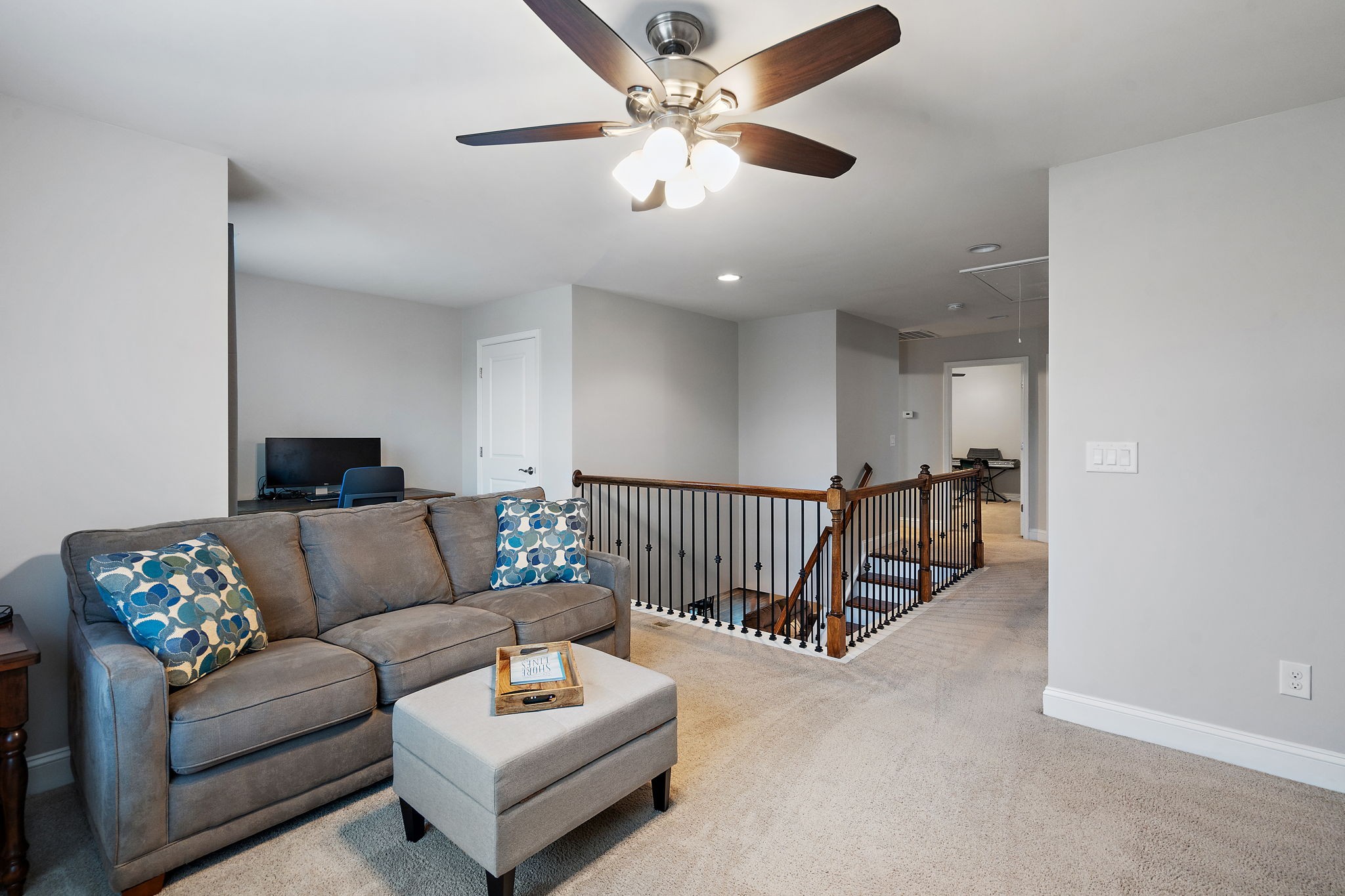 4012 Compass Pointe Court Thompson's Station, TN 37179 - Photo 32 of 54 a living room with furniture and a ceiling fan