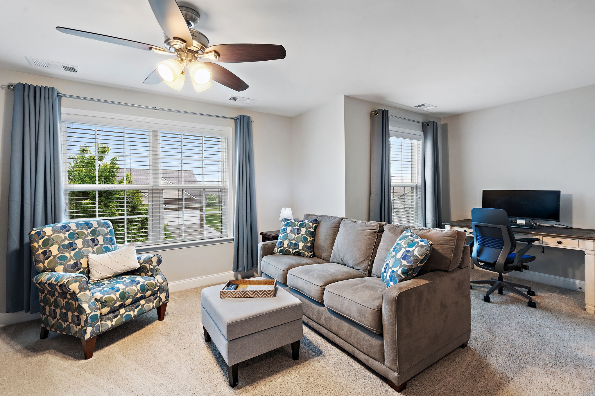 4012 Compass Pointe Court Thompson's Station, TN 37179 - Photo 33 of 54 a living room with furniture and a flat screen tv