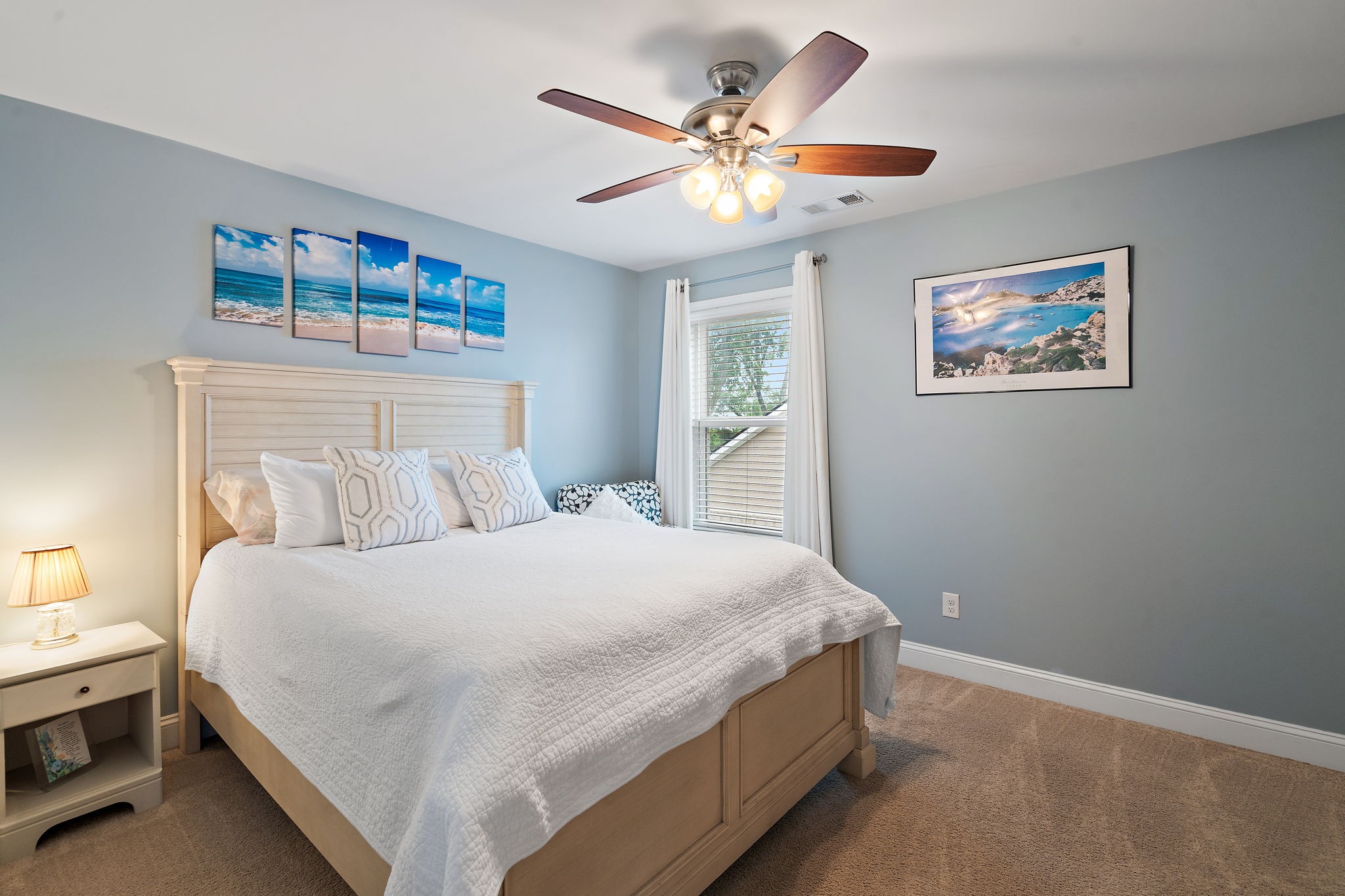 4012 Compass Pointe Court Thompson's Station, TN 37179 - Photo 35 of 54 a bedroom with a large bed and a chandelier