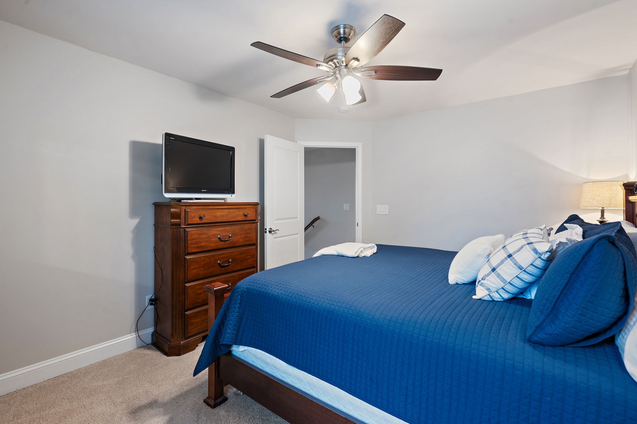 4012 Compass Pointe Court Thompson's Station, TN 37179 - Photo 36 of 54 a bedroom with a bed and a flat screen tv