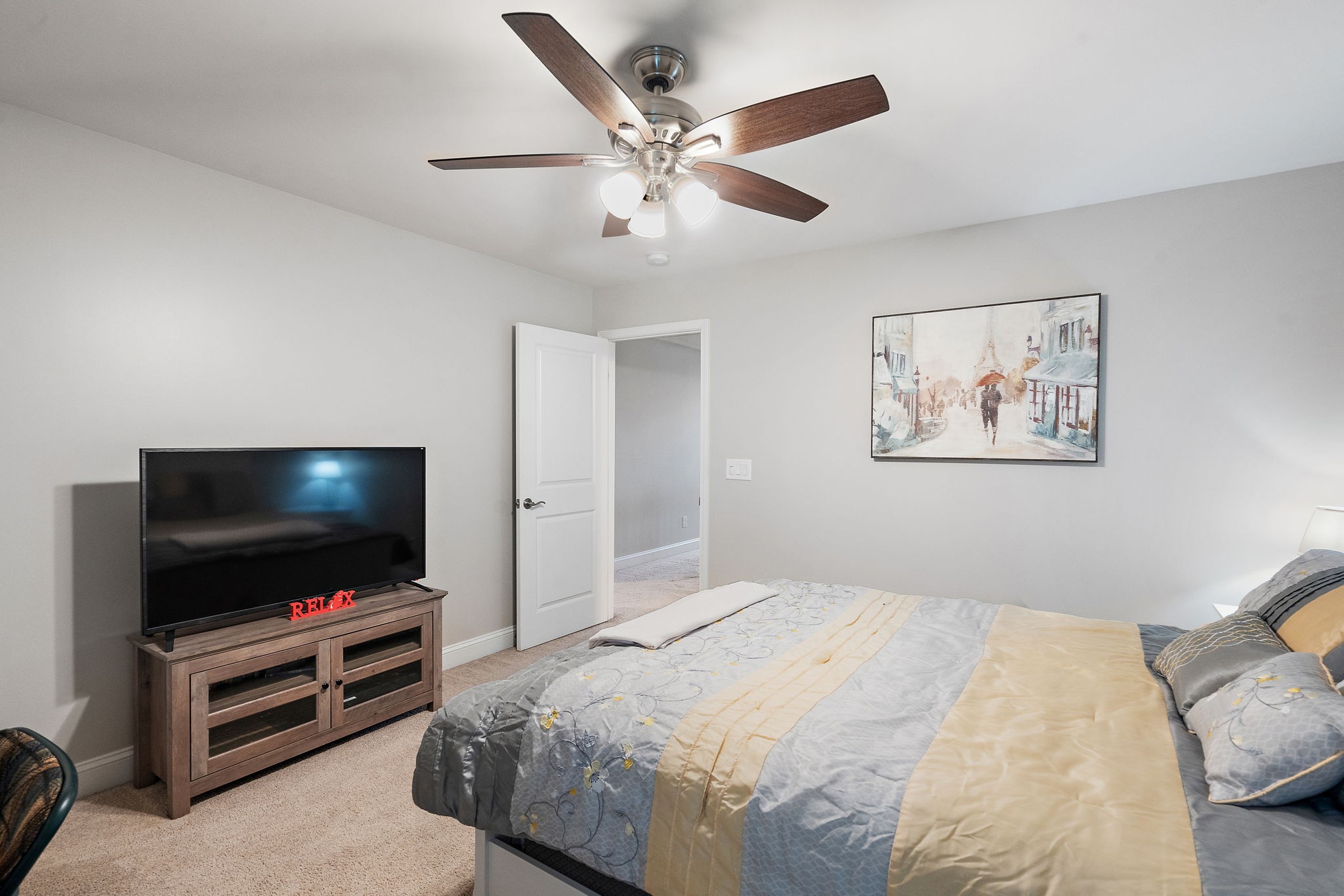 4012 Compass Pointe Court Thompson's Station, TN 37179 - Photo 38 of 54 a bedroom with a bed and a flat screen tv
