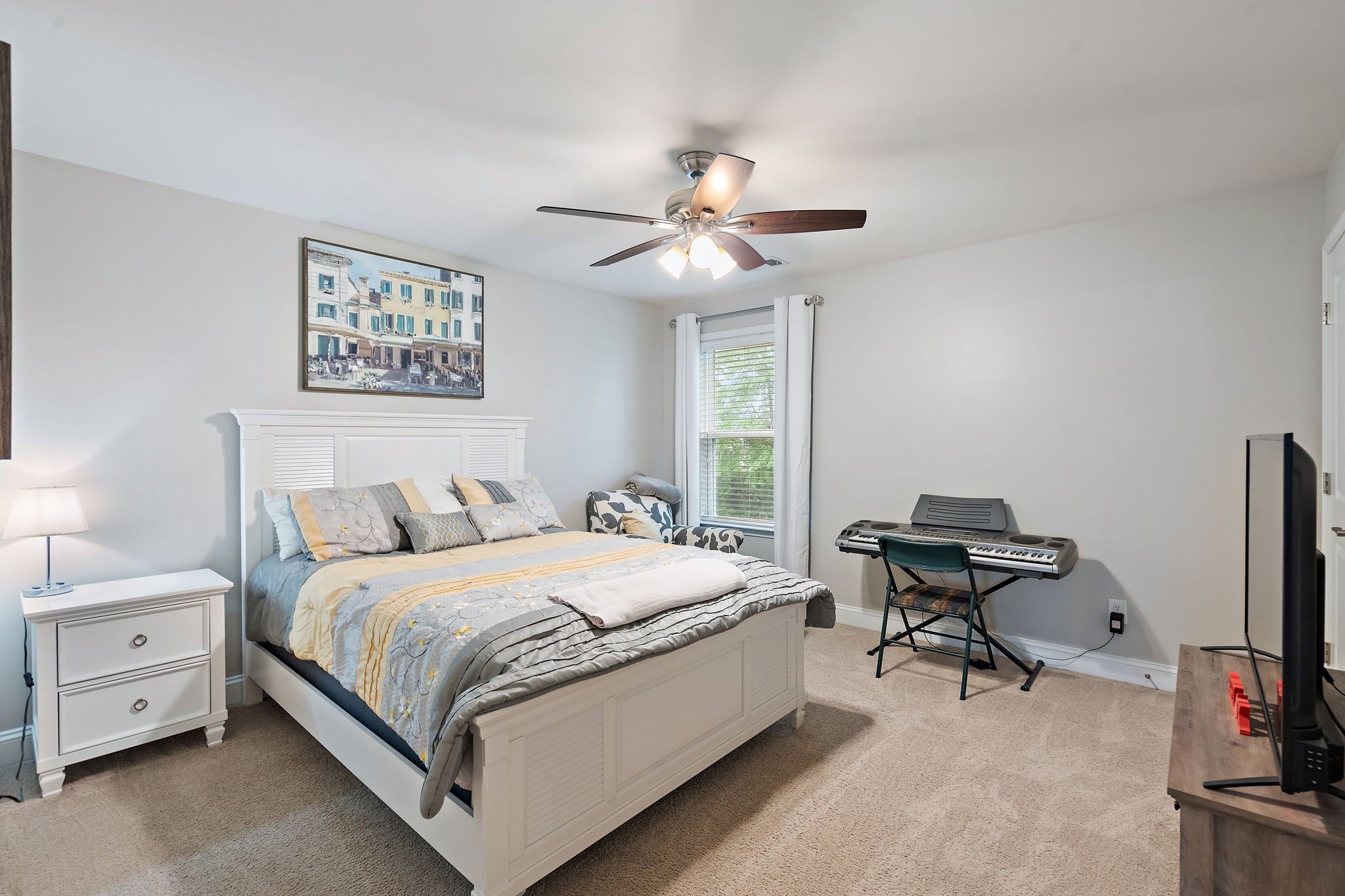 4012 Compass Pointe Court Thompson's Station, TN 37179 - Photo 39 of 54 a bedroom with a bed and a chandelier