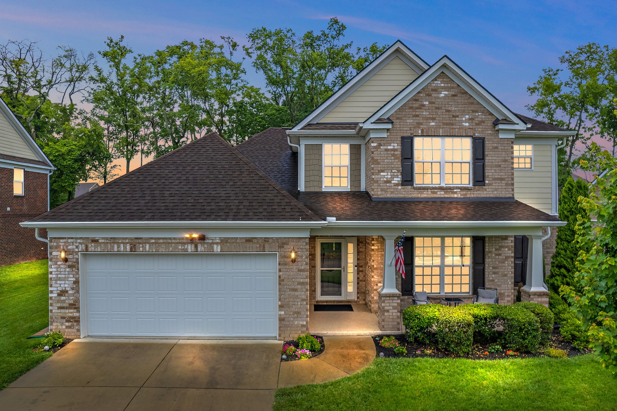 4012 Compass Pointe Court Thompson's Station, TN 37179 - Photo 4 of 54 a front view of a house with garden