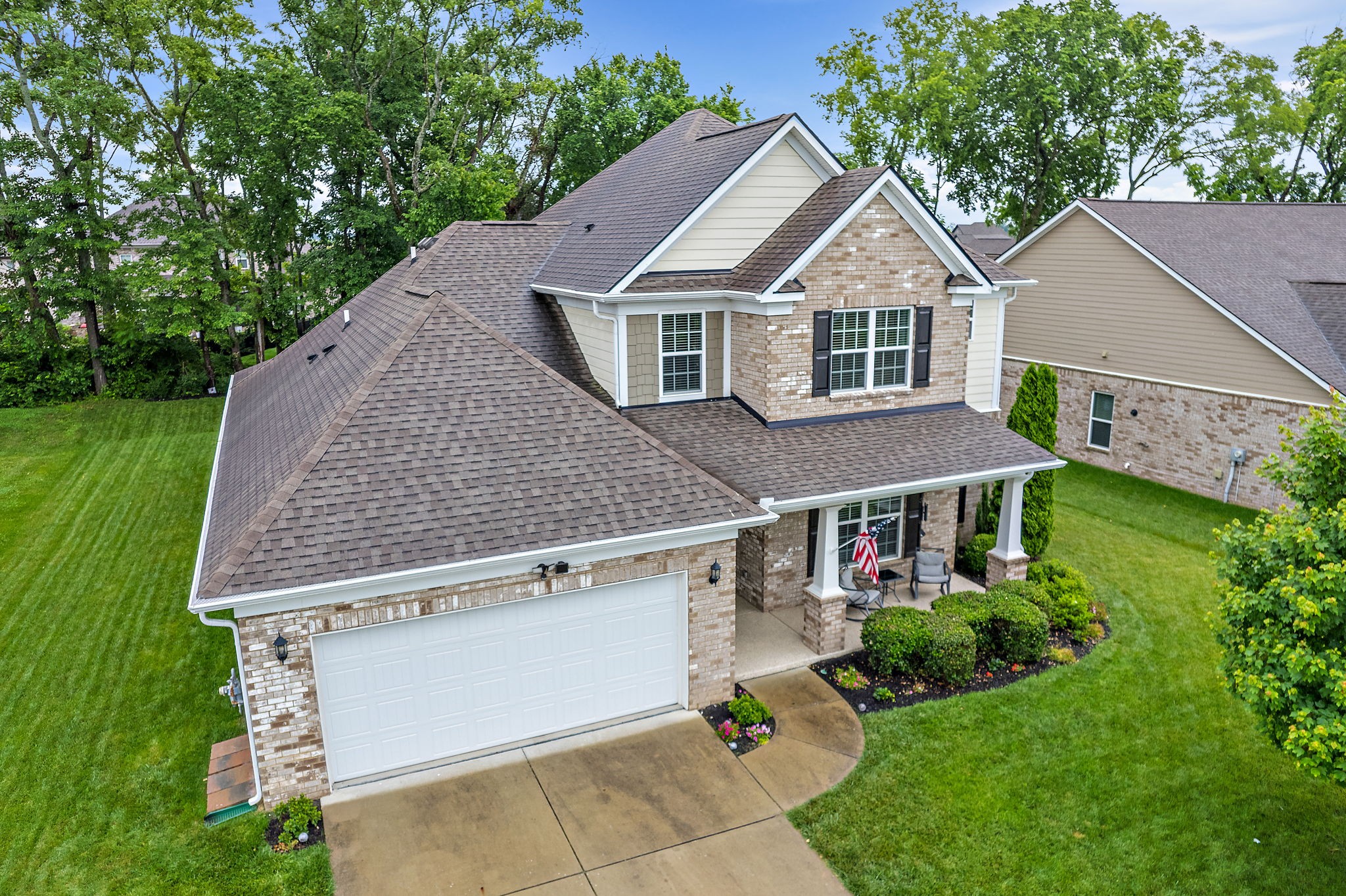 4012 Compass Pointe Court Thompson's Station, TN 37179 - Photo 50 of 54 a aerial view of a house with yard and trees in the background