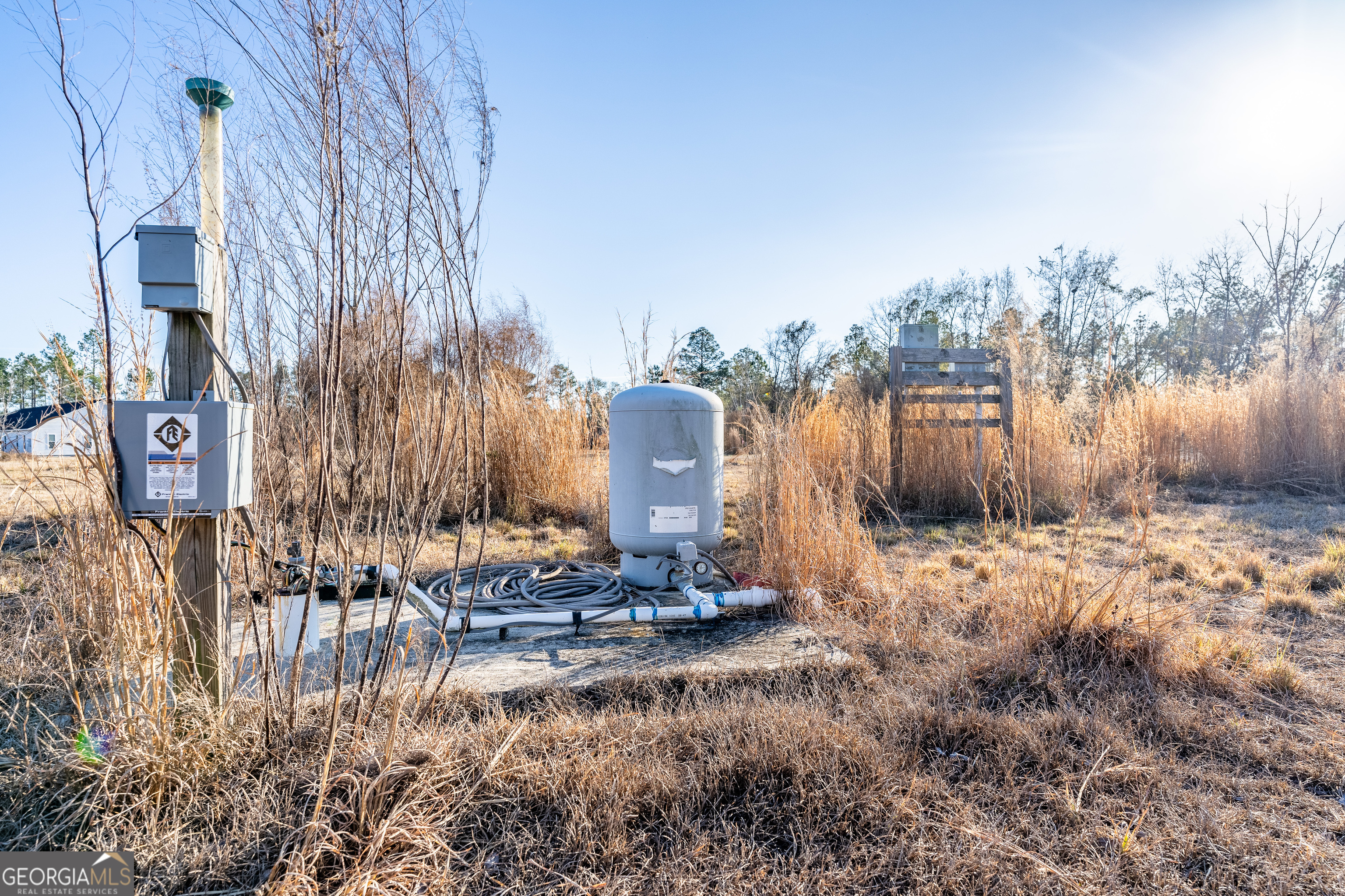 0 Moonshadow Road Homerville, GA 31634 - Photo 13 of 15 a backyard of a house with table and chairs