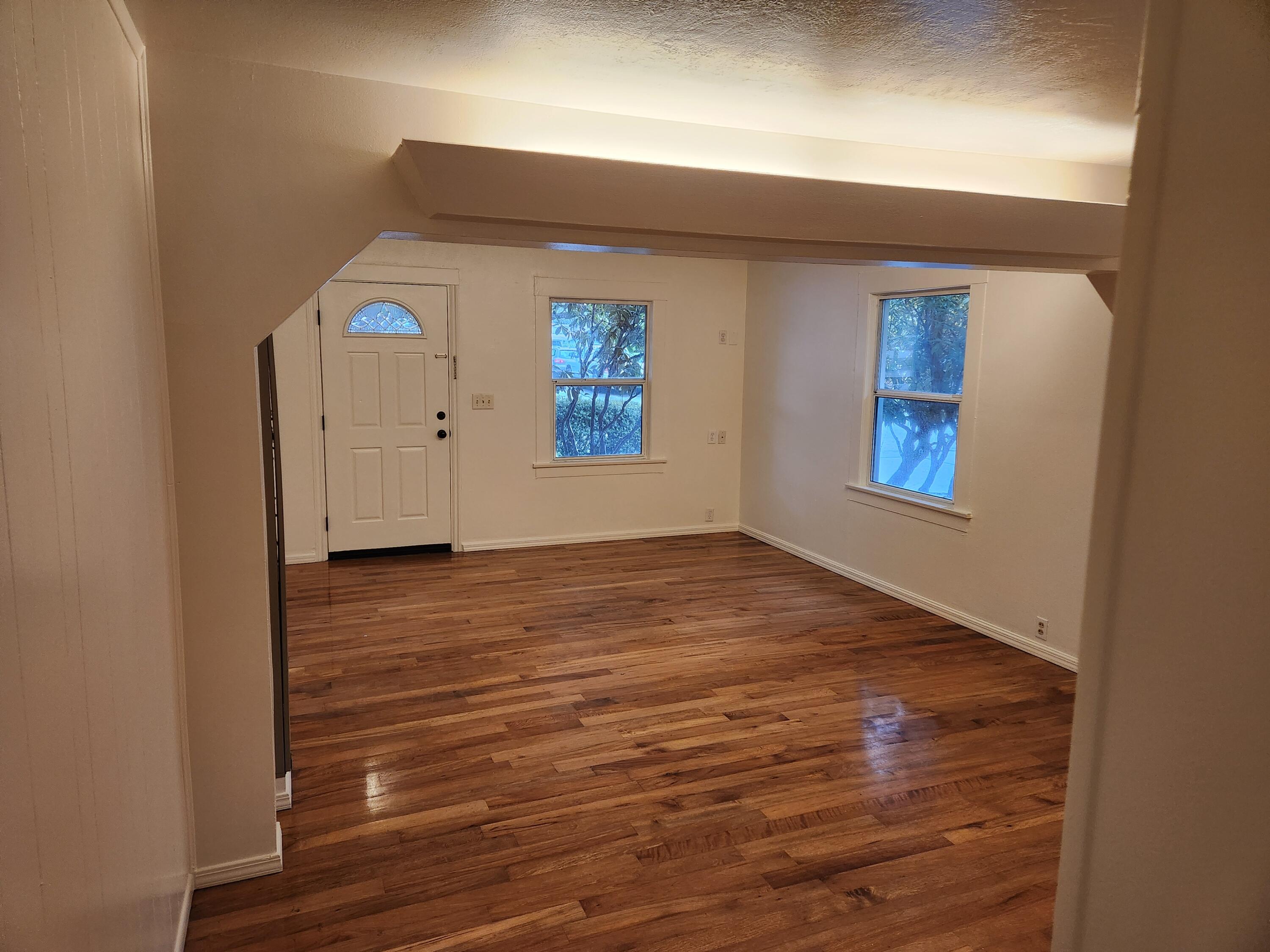 2163 Fern Street Cutten, CA 95503 - Photo 15 of 23 an empty room with wooden floor and window