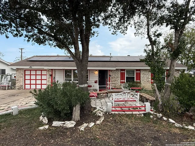 a front view of house with yard outdoor seating and barbeque oven