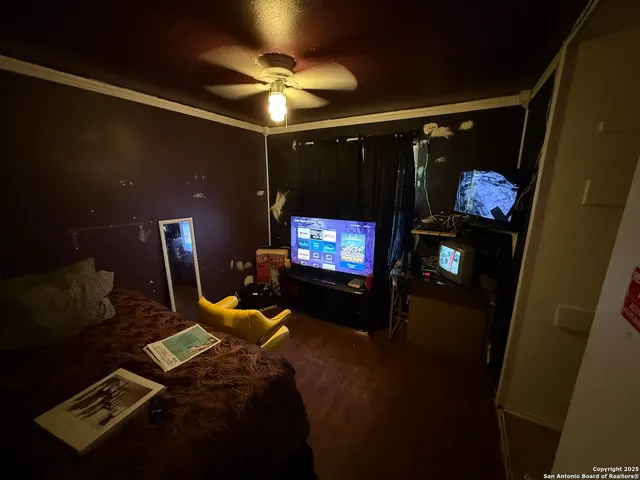 a bedroom with furniture and lamp