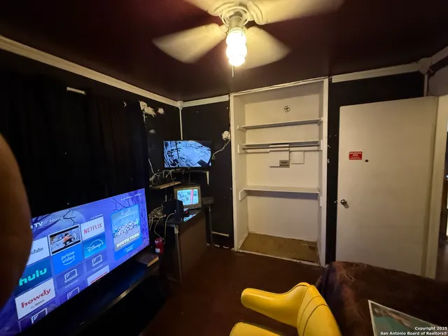 a room with furniture and a flat screen tv