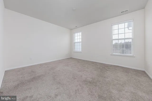 a bathroom with a double vanity sink and mirror