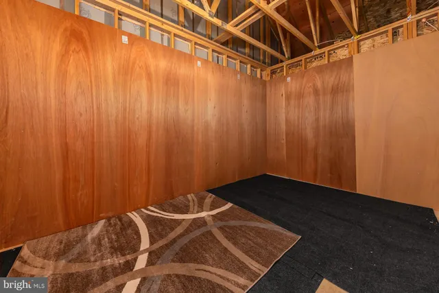 a view of a yard in front of a house with a large tree