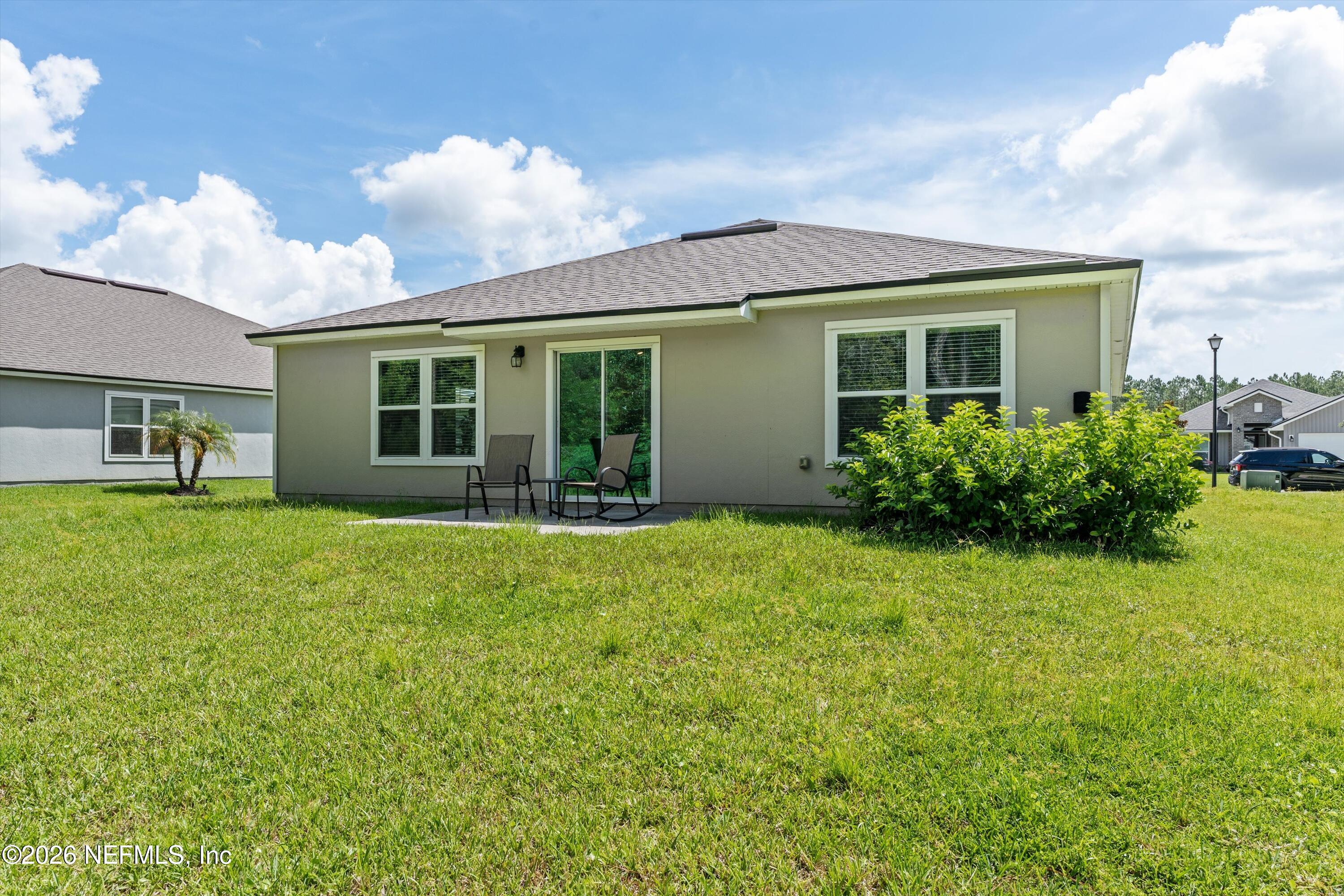 91 Rivertown Road Palm Coast, FL 32137 - Photo 31 of 36 32-Back of Home