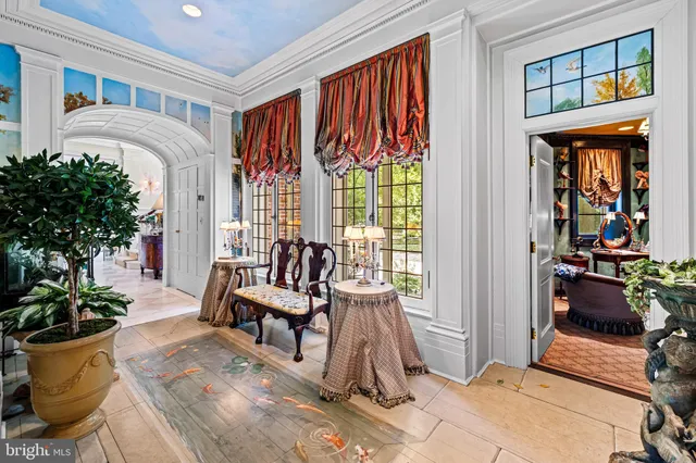 a bathroom with a bathtub and a window