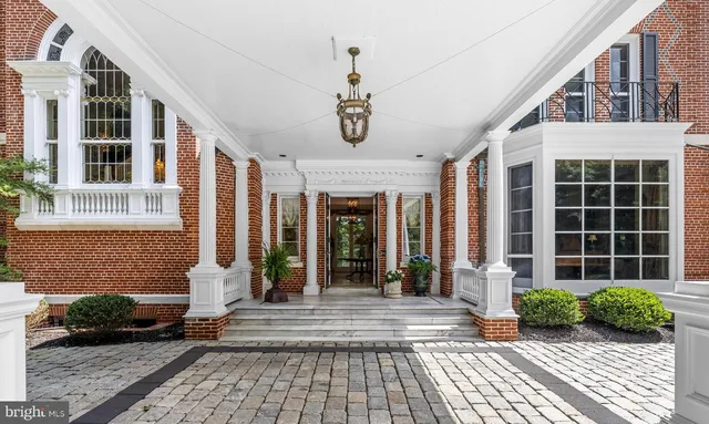 a living room filled with furniture and a large window