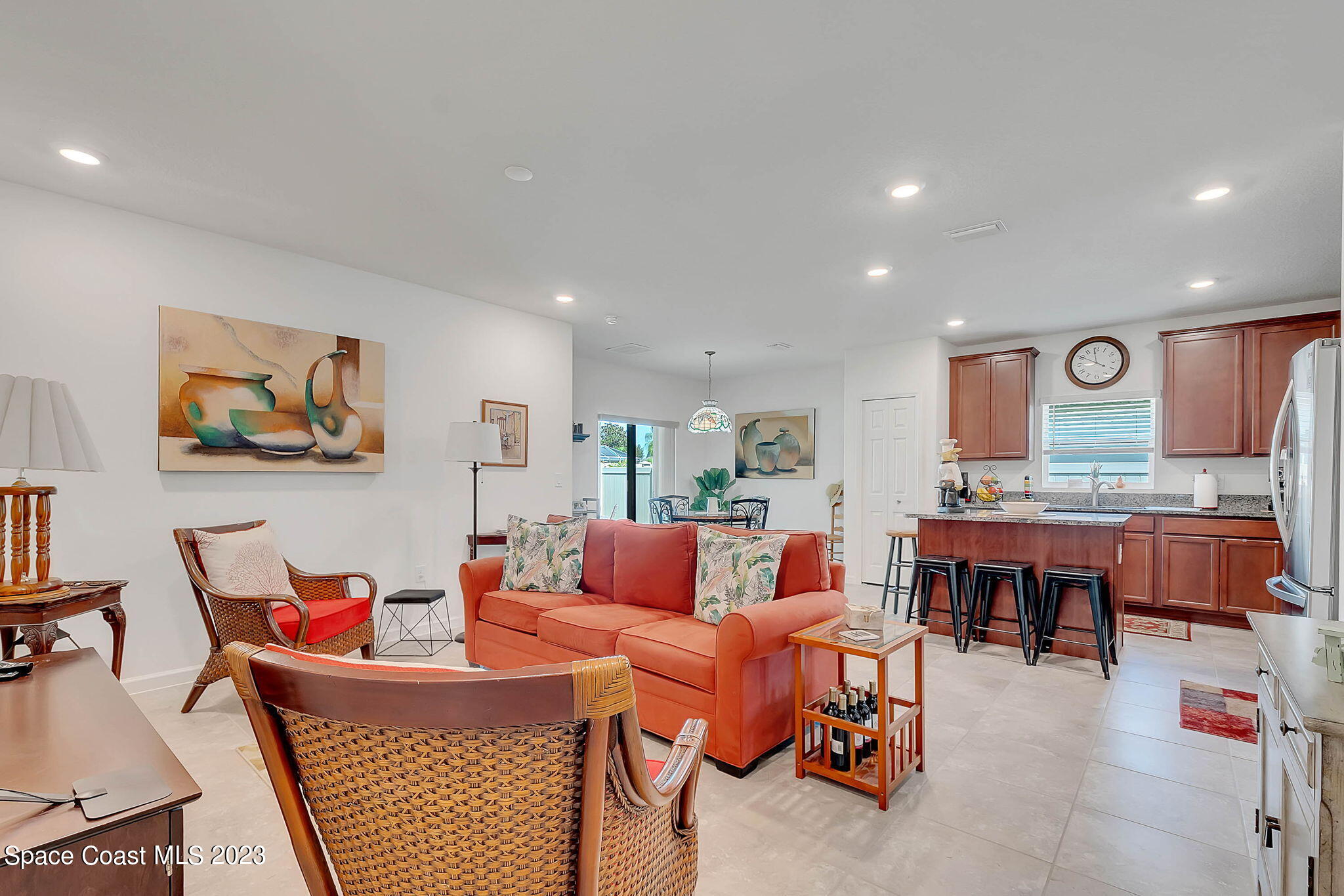 3536 Whimsical Circle Rockledge, FL 32955 - Photo 13 of 40 a living room with furniture a flat screen tv and a table