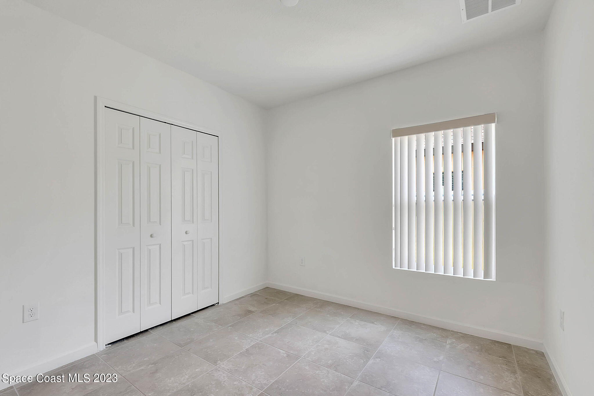 3536 Whimsical Circle Rockledge, FL 32955 - Photo 16 of 40 an empty room with windows