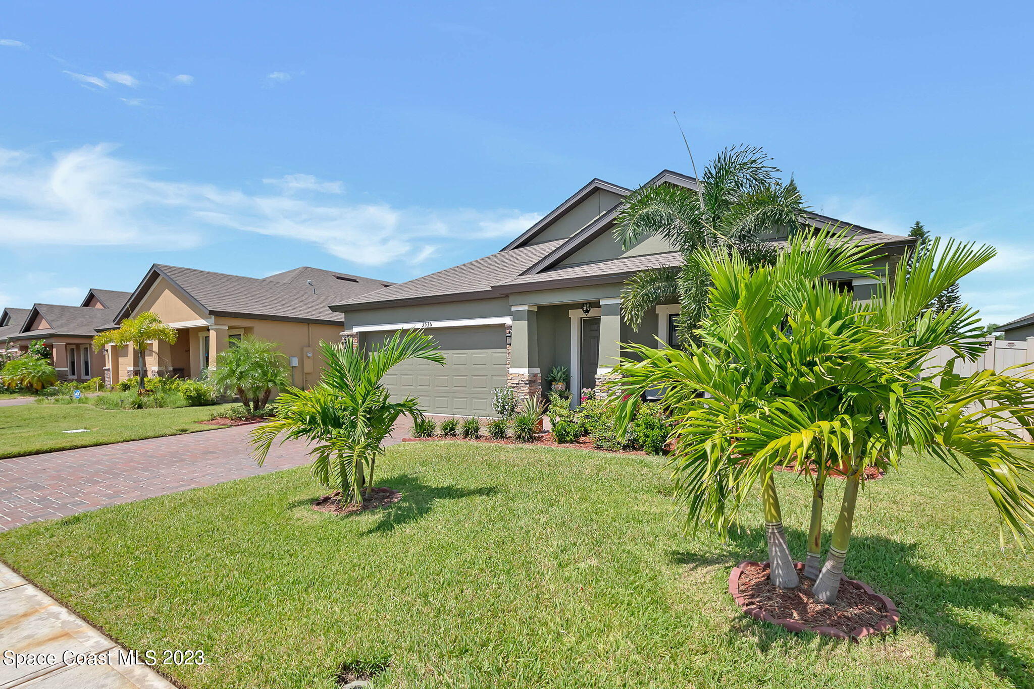 3536 Whimsical Circle Rockledge, FL 32955 - Photo 3 of 40 a front view of a house with a garden