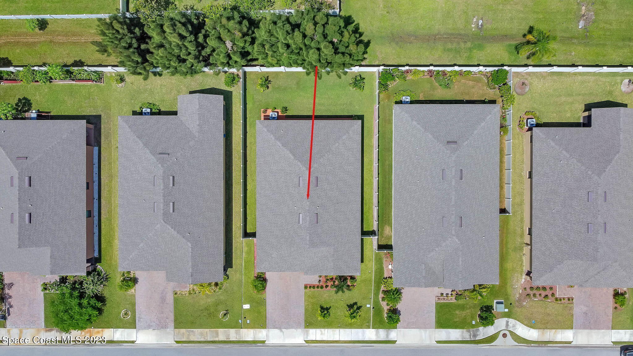 3536 Whimsical Circle Rockledge, FL 32955 - Photo 40 of 40 aerial view of a house with a yard and a large tree