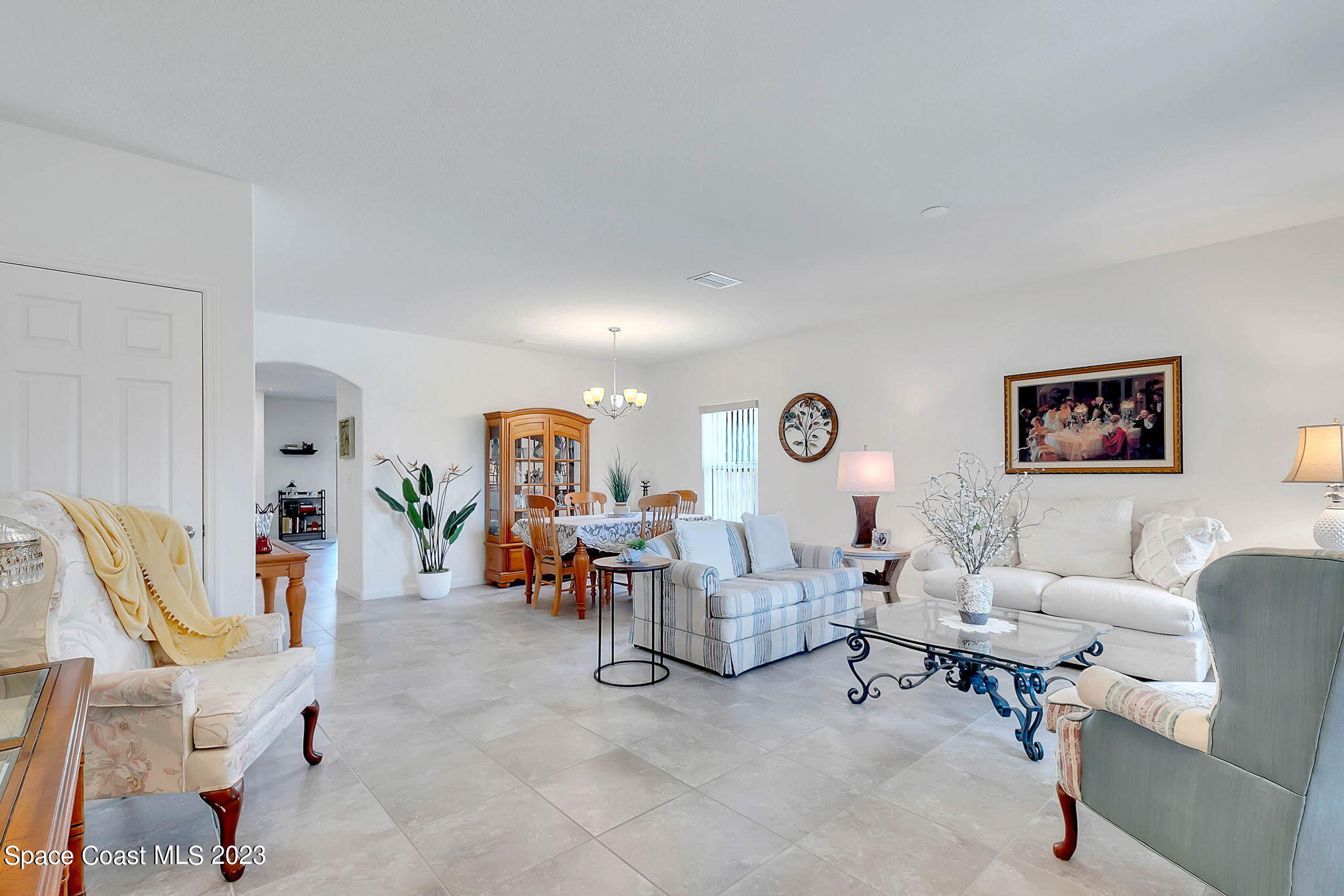 3536 Whimsical Circle Rockledge, FL 32955 - Photo 4 of 40 a living room with furniture and a table