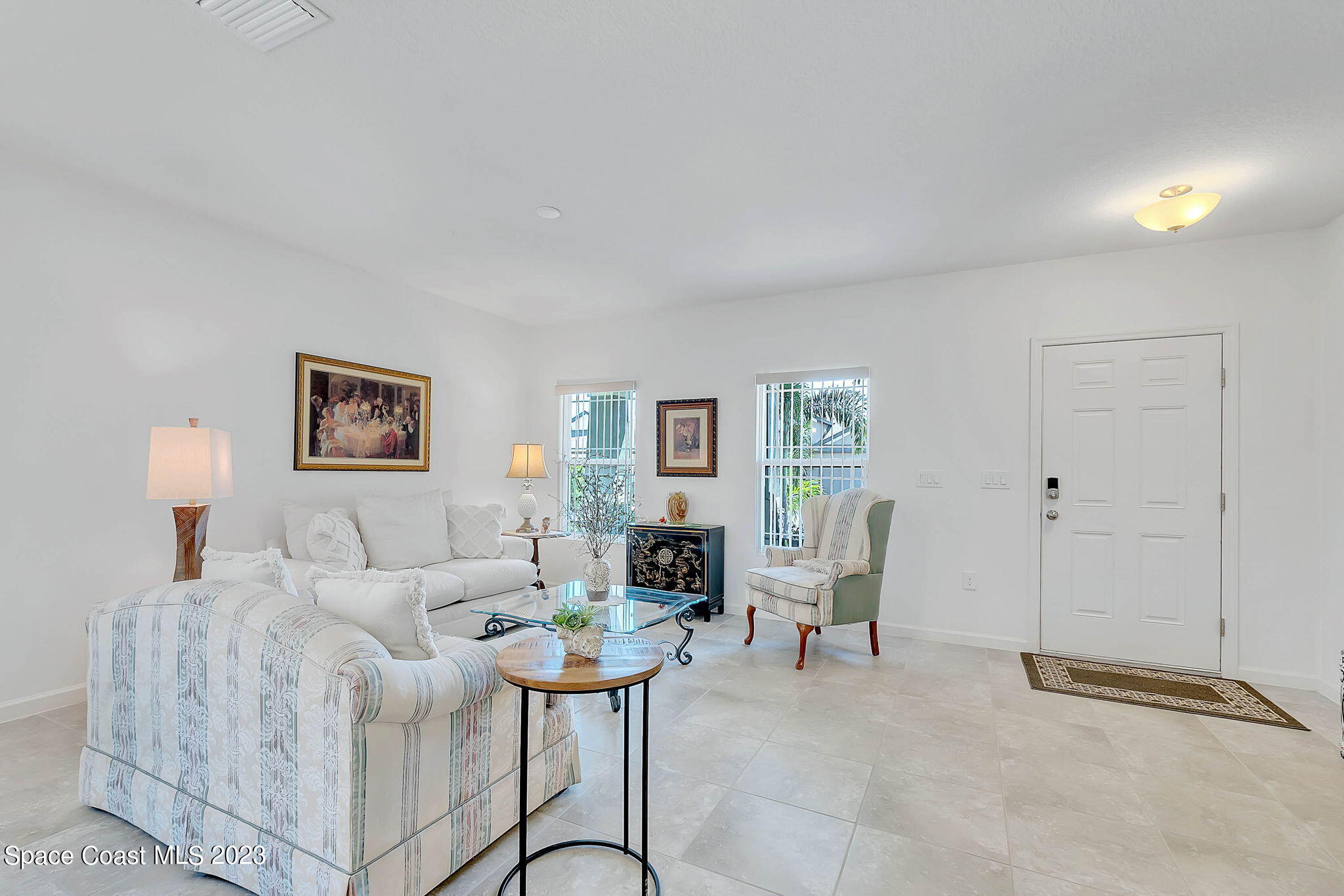 3536 Whimsical Circle Rockledge, FL 32955 - Photo 5 of 40 a living room with furniture and a lamp