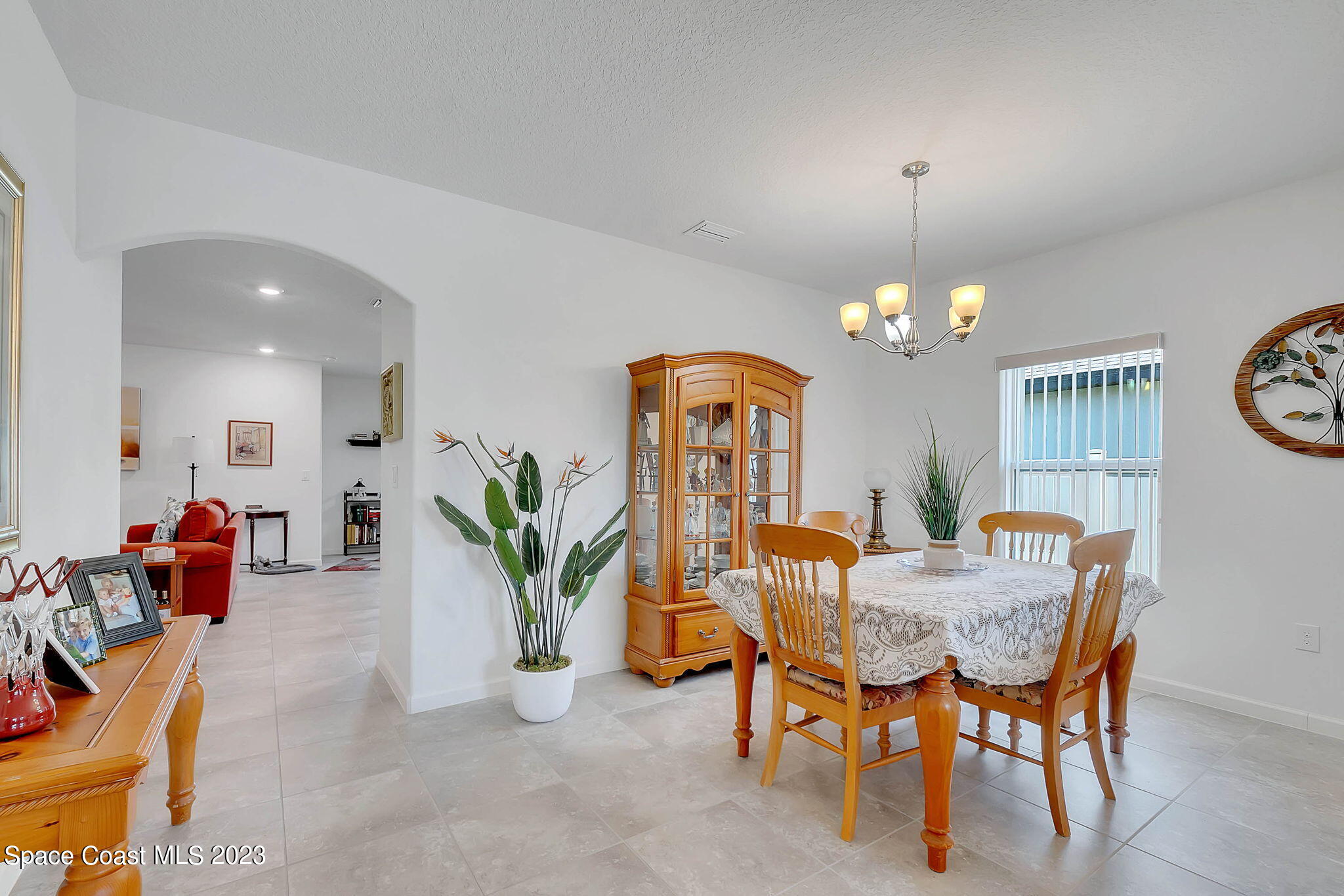 3536 Whimsical Circle Rockledge, FL 32955 - Photo 6 of 40 a view of a dining room with furniture and chandelier