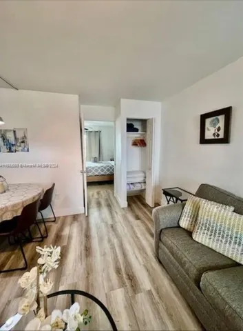 a kitchen with a sink a stove and cabinets