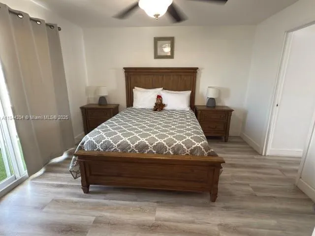 a bedroom with a bed and a walk in closet