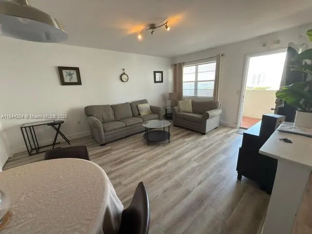a view of a livingroom with furniture and a table