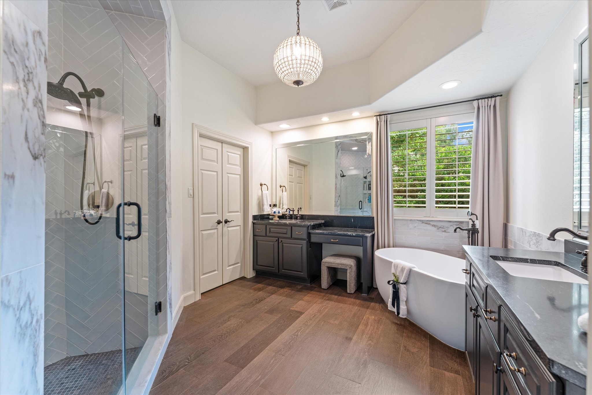 28331 Hollow Springs Lane Spring, TX 77386 - Photo 28 of 49 Exquisite bathroom remodel featuring Calacatta marble and subway tile, a luxurious soaking tub, and elegant granite countertops.