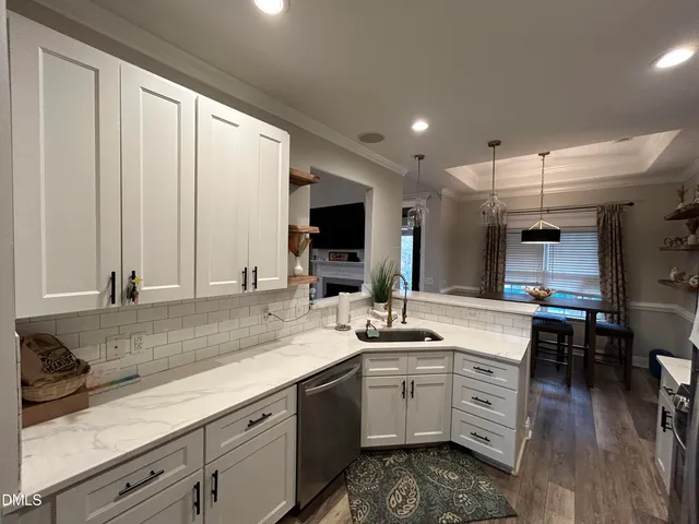 a bathroom with a granite countertop sink mirror and toilet
