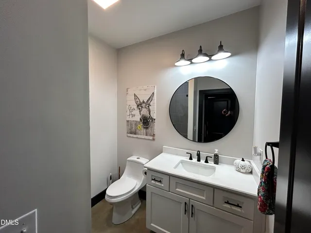 a bathroom with a sink and toilet