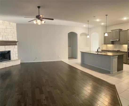a view of kitchen with sink and wooden floor