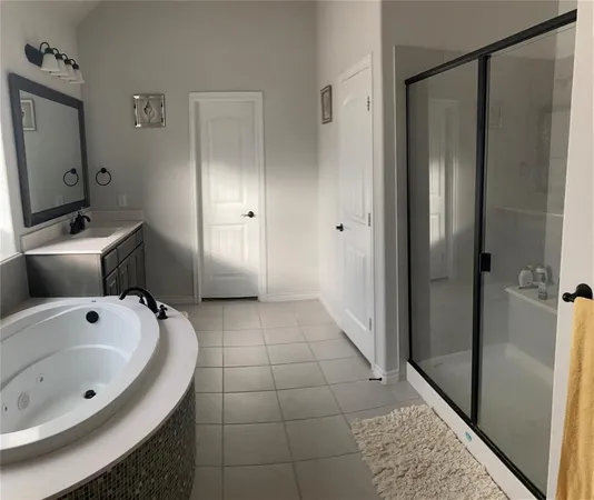 a bathroom with a bathtub and a sink