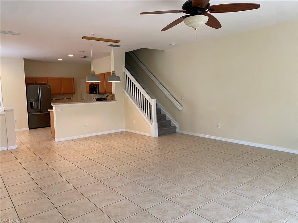 16162 Ravina Way, Unit 65 Naples, FL 34110 - Photo 12 of 12 a view of a livingroom with a staircase