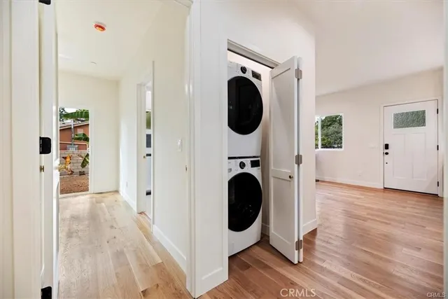 a view of a hallway with washer and dryer