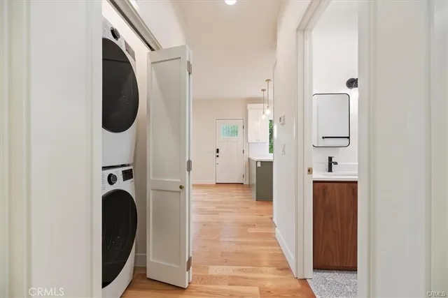 a view of a hallway with washer and dryer