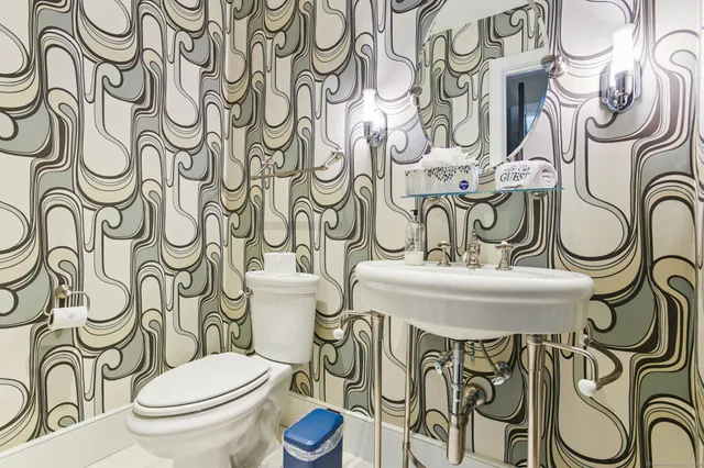 a bedroom with a bed and a lamp