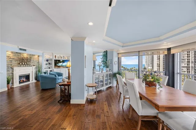 a view of a dining room with furniture window and wooden floor