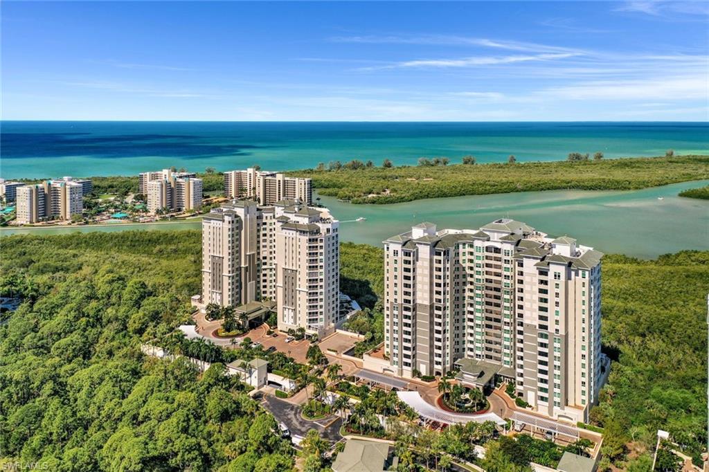 295 Grande Way, Unit 404 Naples, FL 34110 - Photo 25 of 27 a view of a city with tall buildings