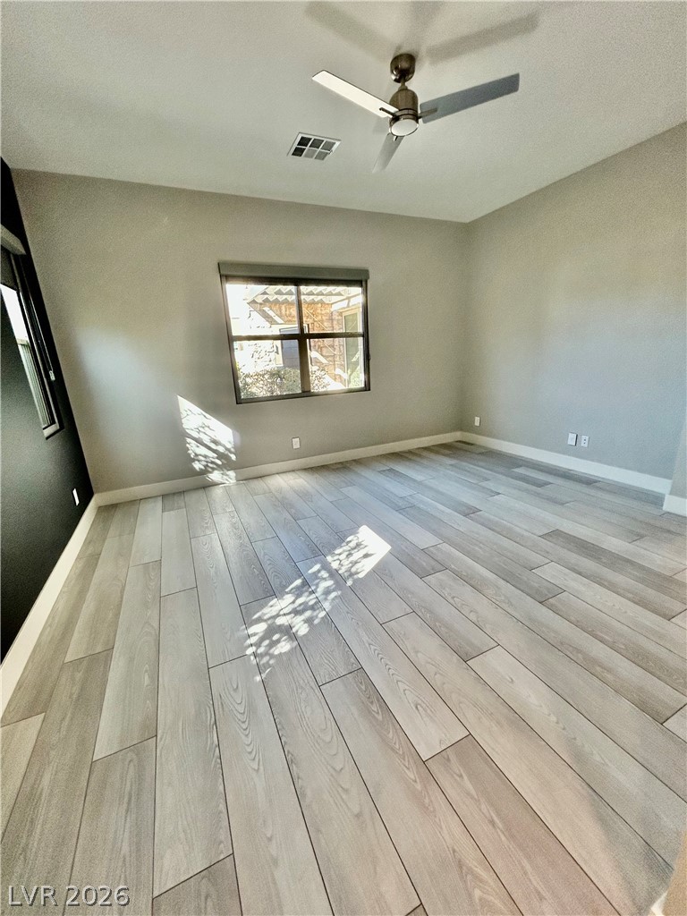 4262 Swift Street Las Vegas, NV 89135 - Photo 57 of 75 Bedroom with light wood-style floors and ceiling fan