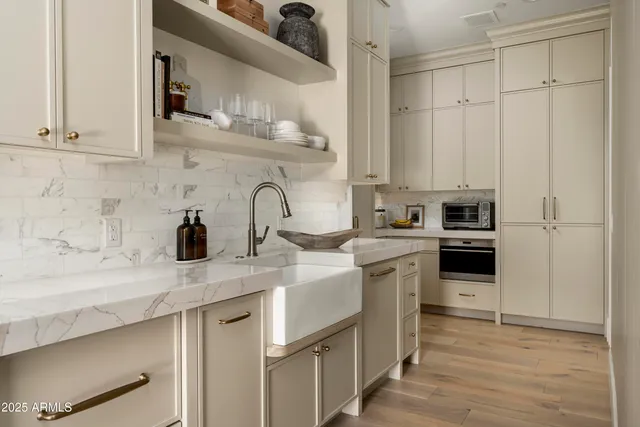 a bathroom with a sink vanity and a mirror