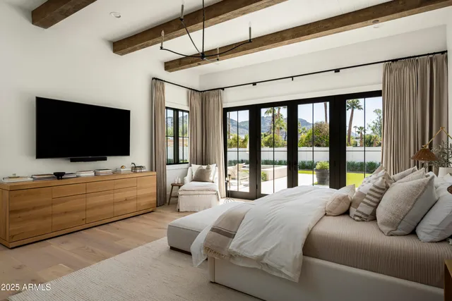 a bathroom with a double vanity sink toilet and shower