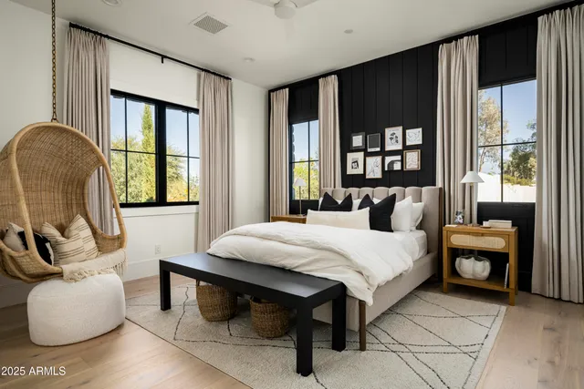 a living room with furniture and a floor to ceiling window