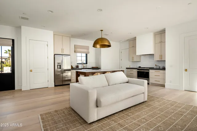 a aerial view of a house with swimming pool and a yard